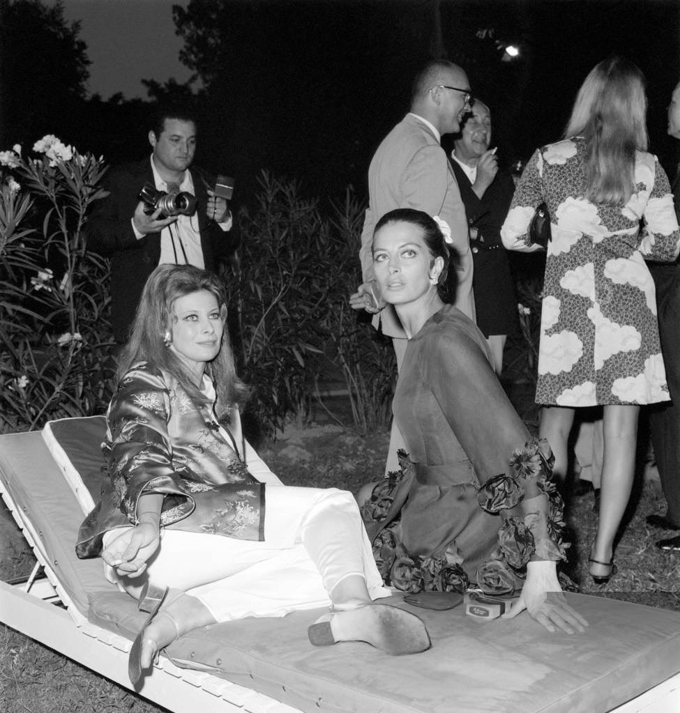 capucine alongside french actress magali noël at the venice film festival in 1969.