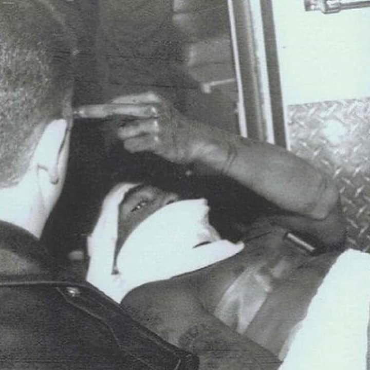 creepydotorg's tweet photo. Tupac on a stretcher after being shot five times, twice in the head, 1994. https://t.co/5rpV1uz90v