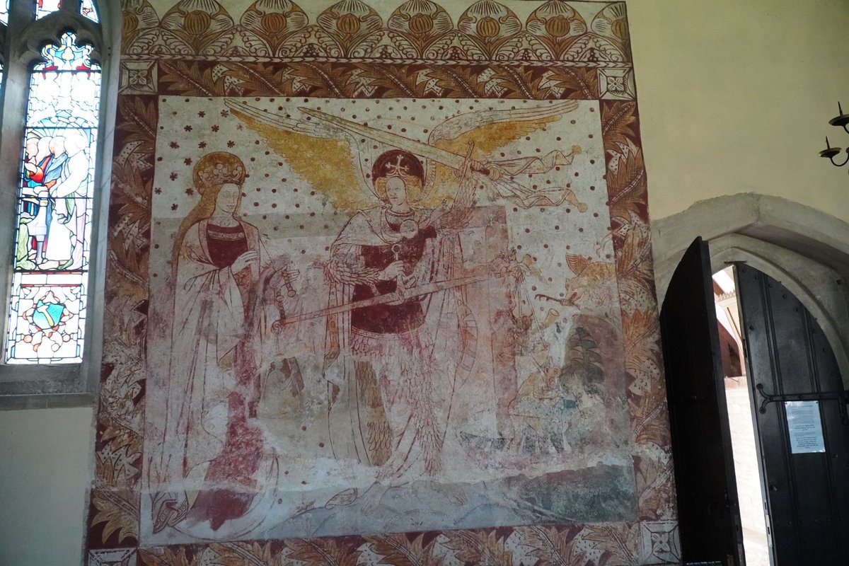 Wall  painting of St Michael weighing a soul with Mary’s aid at South Leigh, Oxon.  A palimpsest with the newer painting sitting over a smaller version of the same theme.  C15 with C19 refurb.