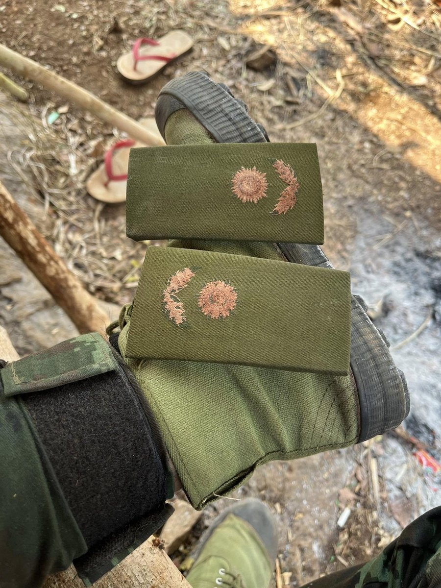 mintommy1993's tweet photo. #PictureOfTheDay

Trashmadaw officers patched on the foot of a PDF soldier as they display the uniforms,badges and weapons of defeated Trashmadaw units

#WhatsHappeningInMyanmar https://t.co/7eftut7IEN