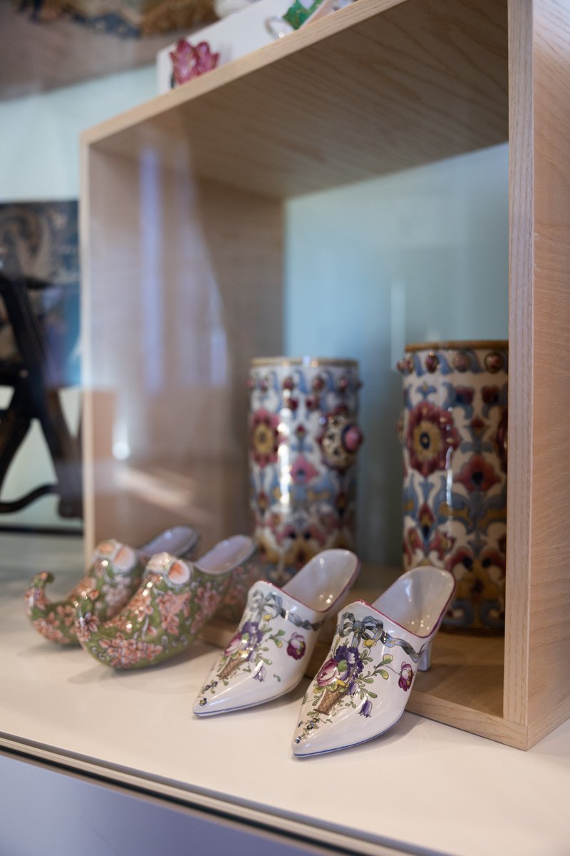 Discover these nineteenth-century porcelain shoes from The Hive. With delicate floral motifs and a tiny basket of flowers, they reflect Europe’s love for "bringing the outside in." Once symbols of elegance and luxury, these charming pieces graced homes as decorative treasures.