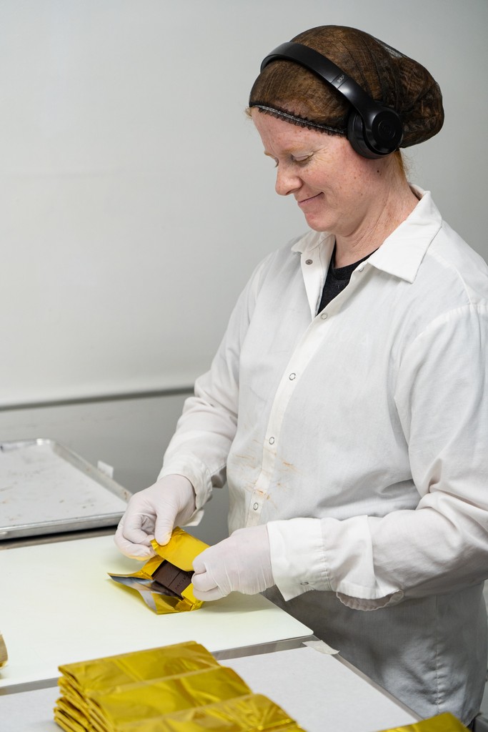 At Moka Origins, chocolate makers hand wrap these delicious chocolate bars after the bars harden. It takes about 30 minutes for chocolate bars to cool enough that they can be removed from the mold.