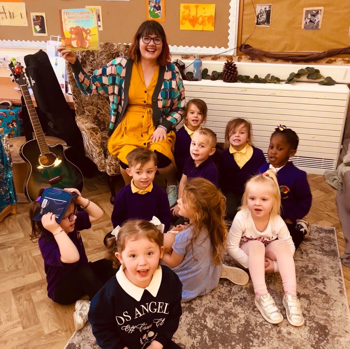 auntyemily's tweet photo. I’m wearing a book cardigan!📚 

Lovely visit to @HareleeshillPS nursery with Crime Squirrel investigators. 

Wonderful singing and dancing to the nuts song! We made the smell of the forest 🪭, solved the mystery and the water swirling was a hit, along with the giant pinecone! https://t.co/APvHpg0q0z
