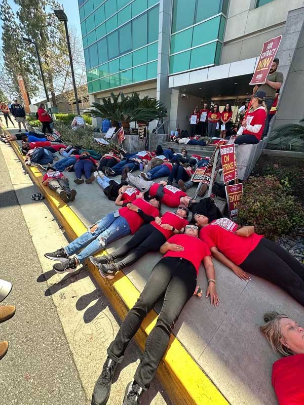 Striking Kaiser mental health workers and supporters in San Diego participated in a "die-in" to commemorate the lives lost due to Kaiser's underfunded and understaffed mental health system. #MentalHealthMatters #nuhw