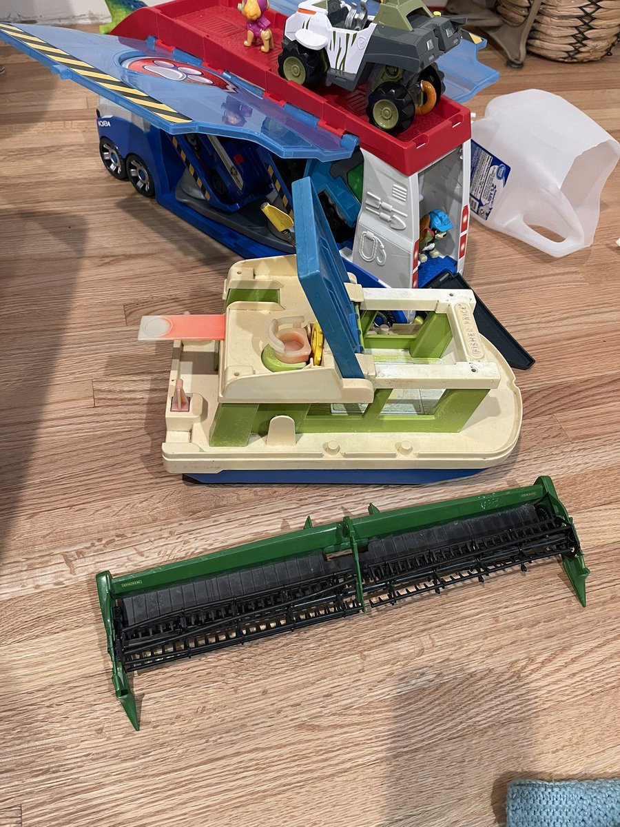 rossickle's tweet photo. @bmreadel @kw900lkevin @serendipitidoda My children still play with them! The boat with a sun faded diving board next to a much more modern 40ft Draper header and paw patrol setup. https://t.co/Gt6OxfX3IJ