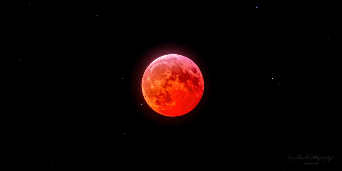 Were you able to enjoy the total lunar eclipse last night? I was able to get this shot when the "Blood Moon" peaked out briefly from the clouds.