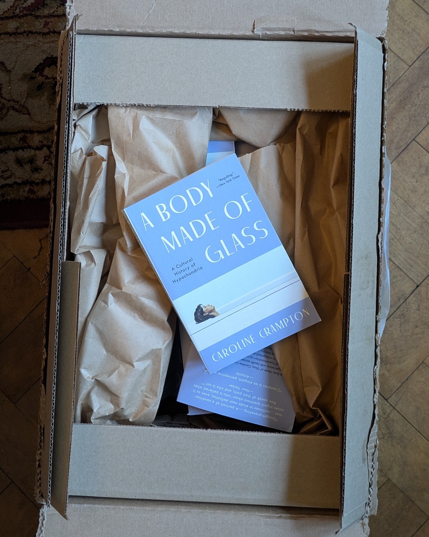 The paperback of A Body Made of Glass is now available in both the UK and the US! Morris the dog got very excited when I opened the box from @grantabooks and took one for himself immediately. The <a href="/eccobooks/">Ecco</a> edition was appreciated a little more conventionally...