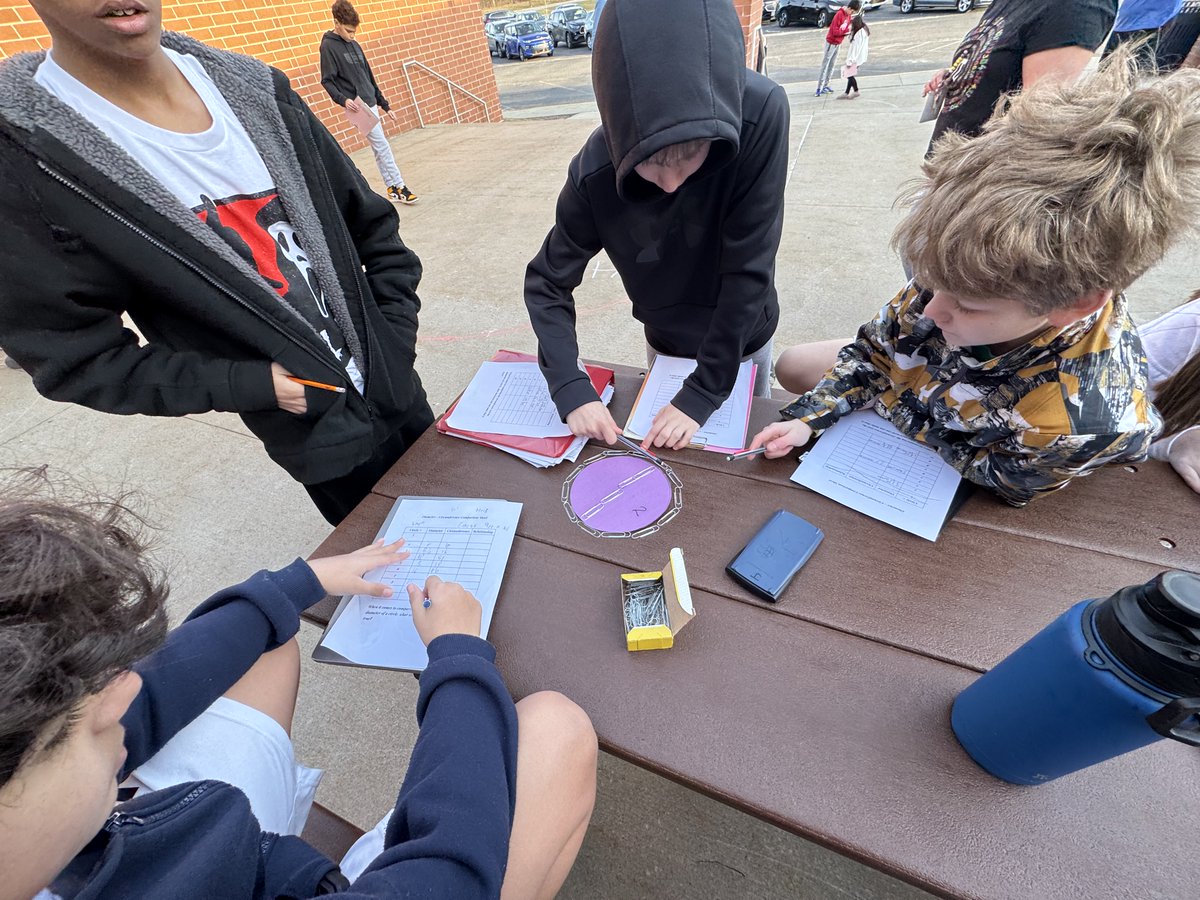 At the Middle School students in Mrs. Johnston's math class are learning about Pi! The class got to go outside to test circles diameter and circumference with non traditional measuring items: paper clips, actual walking feet, cubes, etc. <a href="/StreetsboroMS/">Streetsboro Middle School</a>