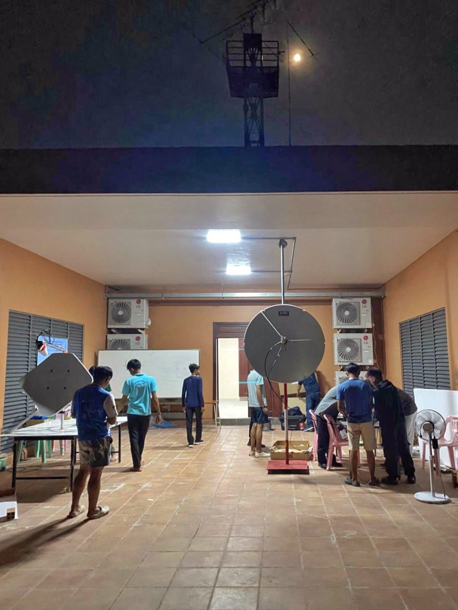 F5VMJ's tweet photo. Many thanks to you all. Quick update:
- QSB seems worse towards the end of the day, so I will try to be QRV earlier in the mornings and see how it goes.
- Temperature is about 35degC in shade. My laptop overheats and freezes. NPIC staff have now kindly made possible an ethernet connection to the club room (with aircon).
- My SDR ground station is still near dish of course and temperature controlled cooling fans are always at max (fingers crossed for no heat issues).
- Most students live on campus 24/7 and are very keen. My attention and time goes 100% to them first.
- Please do not send me emails. All info is on https://t.co/xMJWS7PpDj and is updated by the organisers. We have a full day and replying to all queries takes me too much time at night, sorry.
- Visit Cambodia 🇰🇭 It is a wonderful country with warm, smart and gentle people.
#qo100 #amsat #AmateurRadio