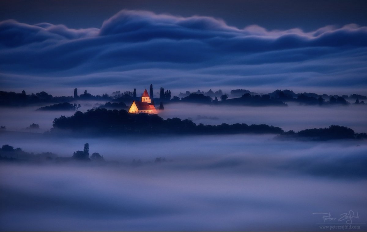 "Shining bright" by <a href="/Rimarcek/">Peter Zajfrid</a> is a finalist in the #bluehour photo contest!

Benedikt church peeking above the fog in Slovenia captured with a #NIKOND810