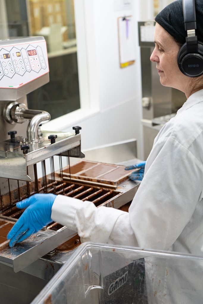 During the tempering process, Moka Origins’ chocolate is alternately heated and cooled to break down the crystals and give the final product the best texture, a glossy sheen, and a crisp snap.