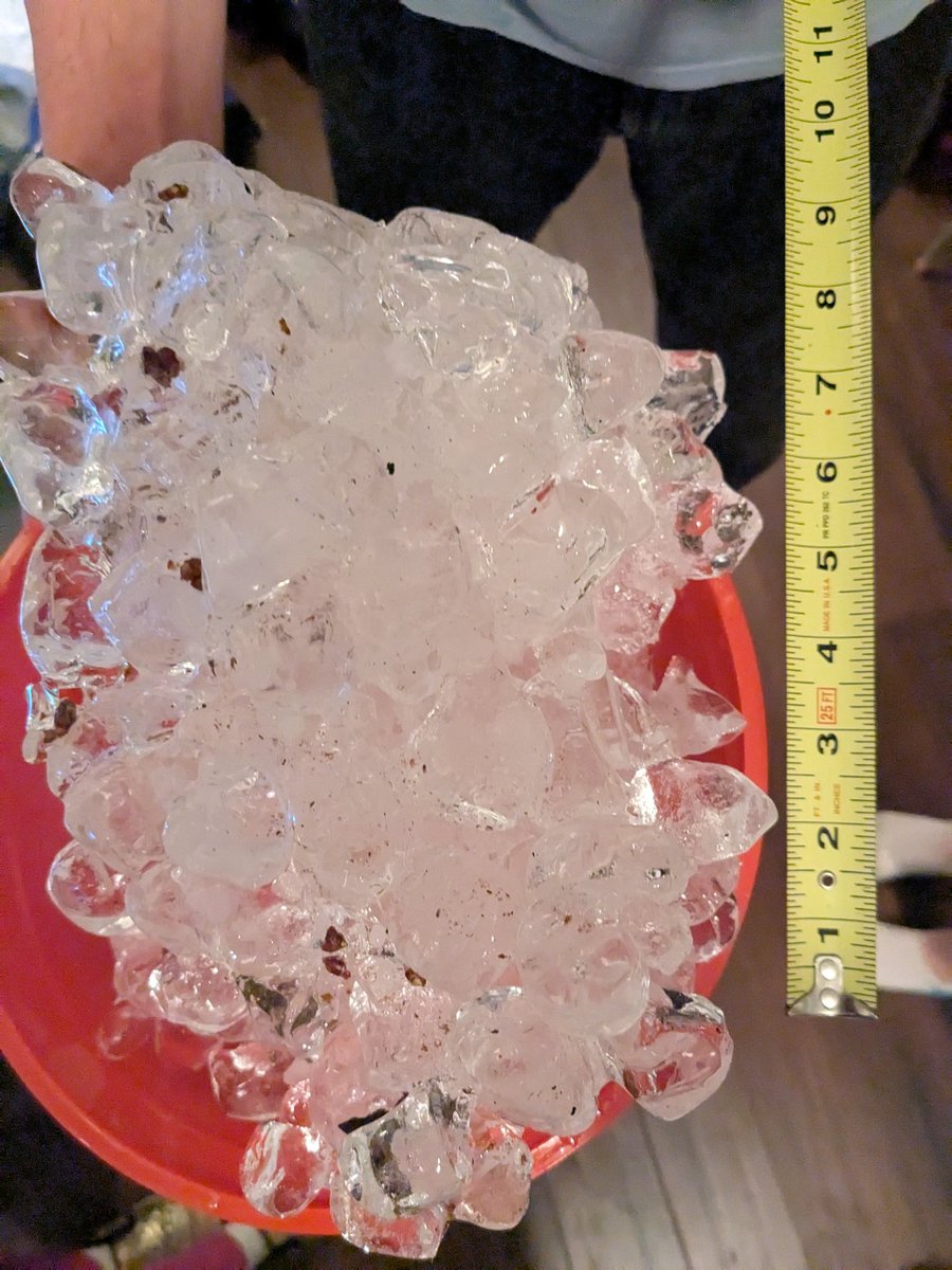 Larsnarsbars's tweet photo. Y'all, this is not a poured-out bag of ice, this fell from the sky *just like this* three feet from my car windshield 💀 #stlwx @scottontvKSDK @SteveTempleton https://t.co/N5myNQseTV