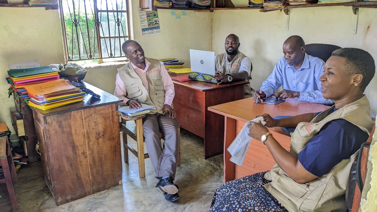 UCA team interacting with the Bulambuli Commercial Officer on a monitoring and supervision exercise to follow up on the implementation of the cooperatives' activities in the district.