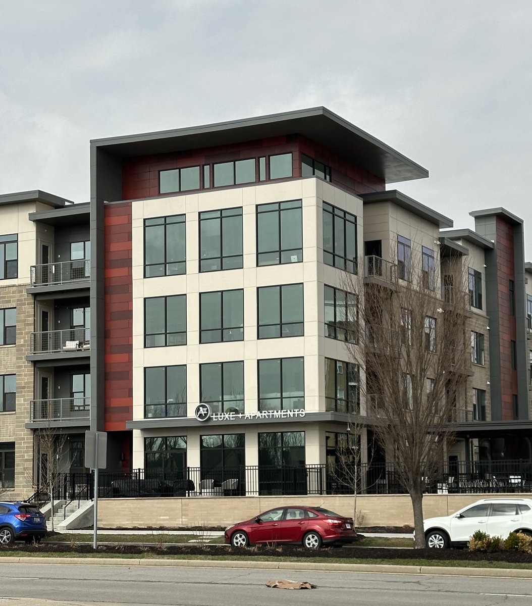 Contemporary multifamily architecture with running bands that now wrap around and become a cornice element. Seen all around the country. #architecture #multifamily #apartments