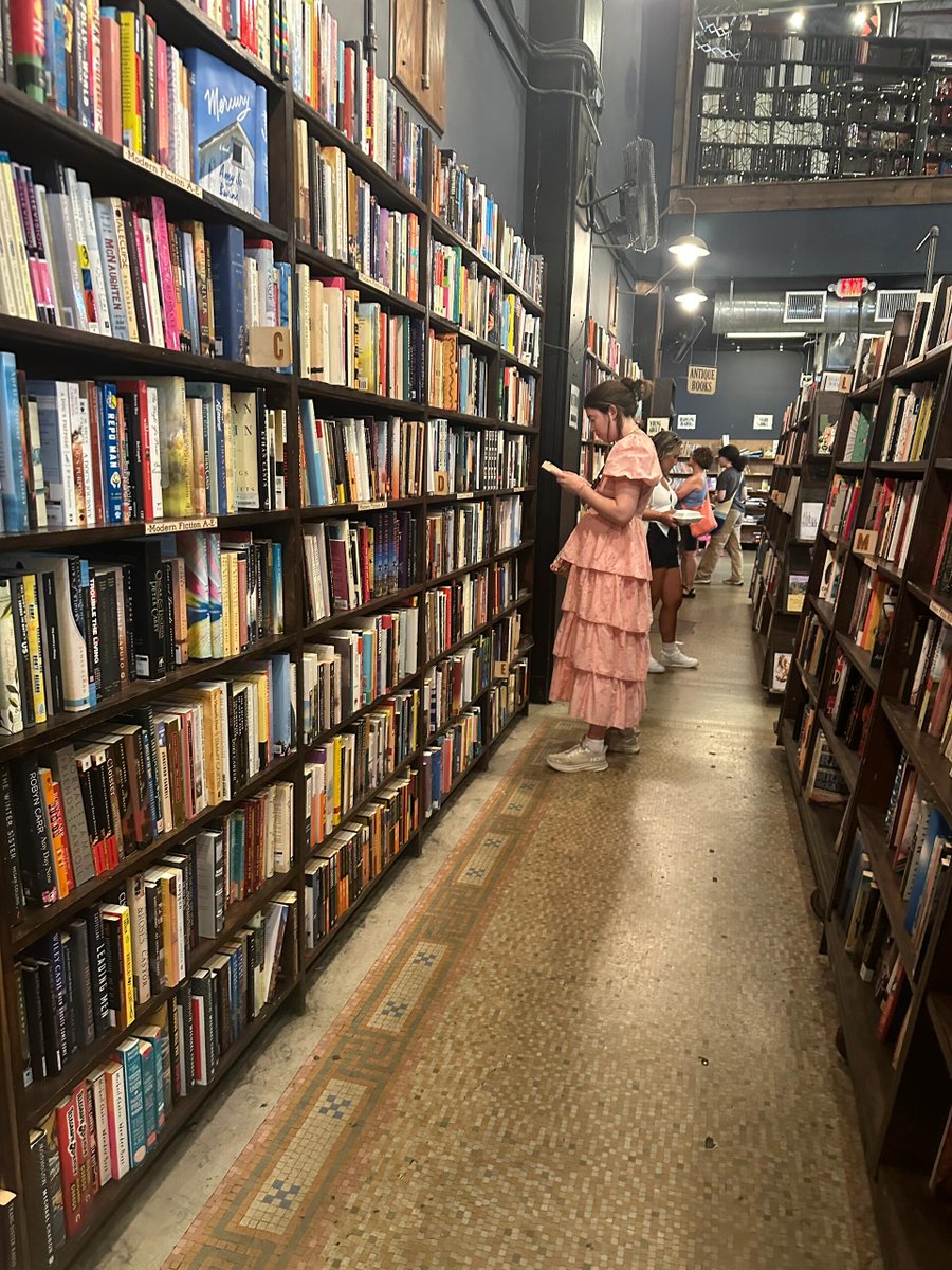 Browsing the bookstore on a free weekend morning.