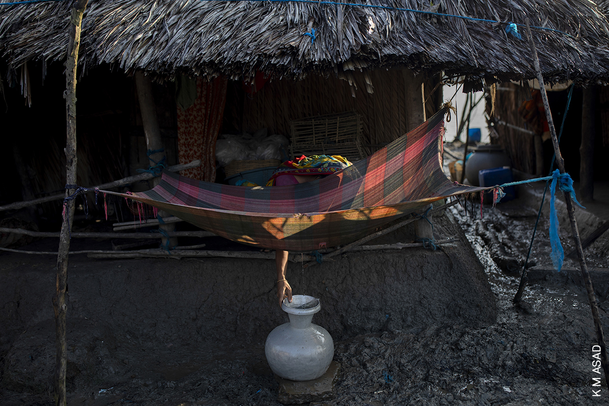 Photo of the Day | A woman draws drinking water from a cloth set out to catch rainwater, in the village of Kalabogi, Bangladesh. Learn more about the photo by <a href="/kmasad04/">K M Asad</a>, awarded in the 2021 Contest: worldpressphoto.org/collection/pho…
