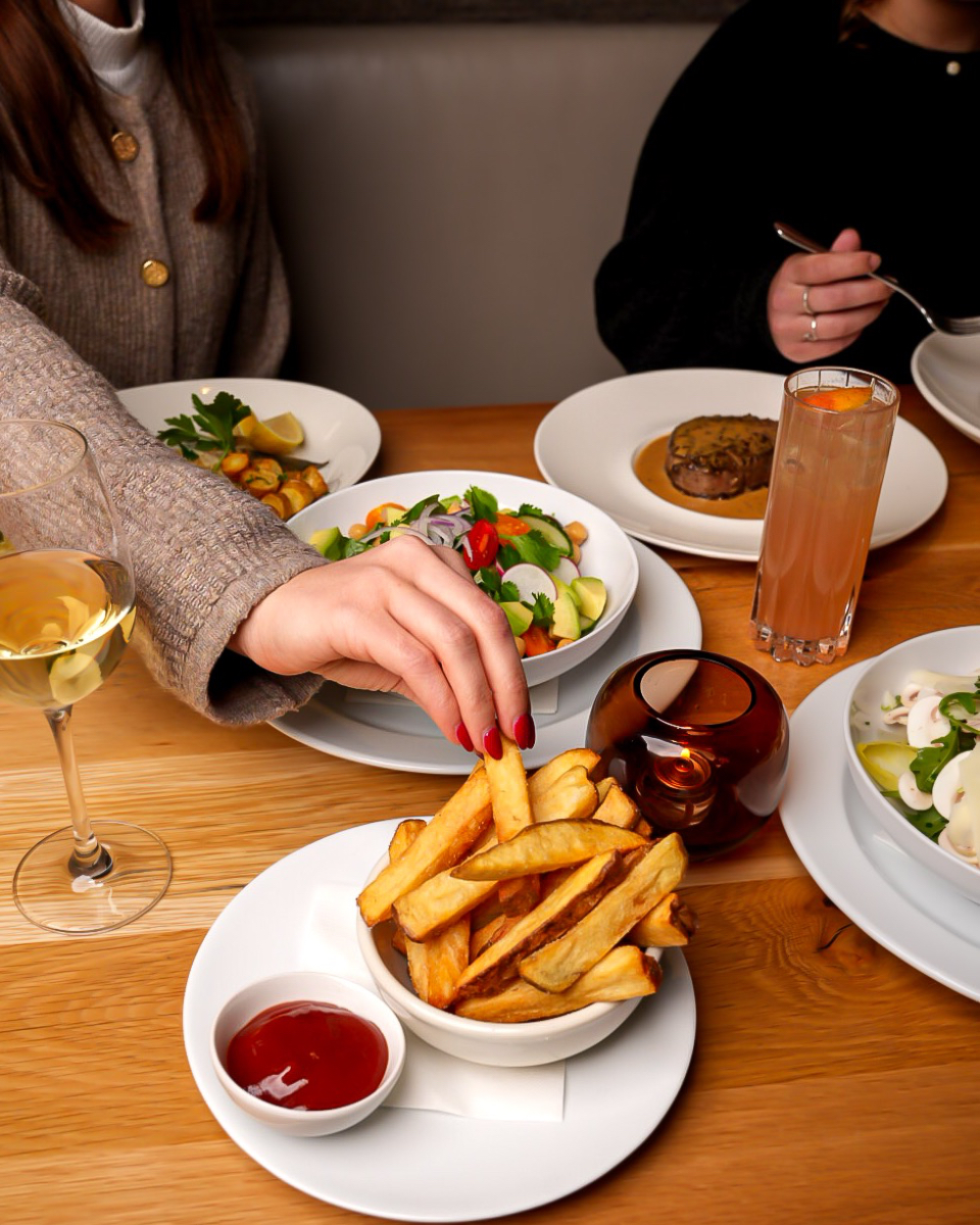 The perfect evening with family and friends — soaking in our warm atmosphere, sipping a glass of wine or a cocktail, and savoring every bite of our flavorful cuisine 💫