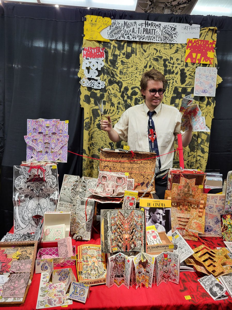 Delighted to see <a href="/CartoonTycoon/">A. T. Pratt</a> snipping &amp; folding at aMoCCA Fest 2025