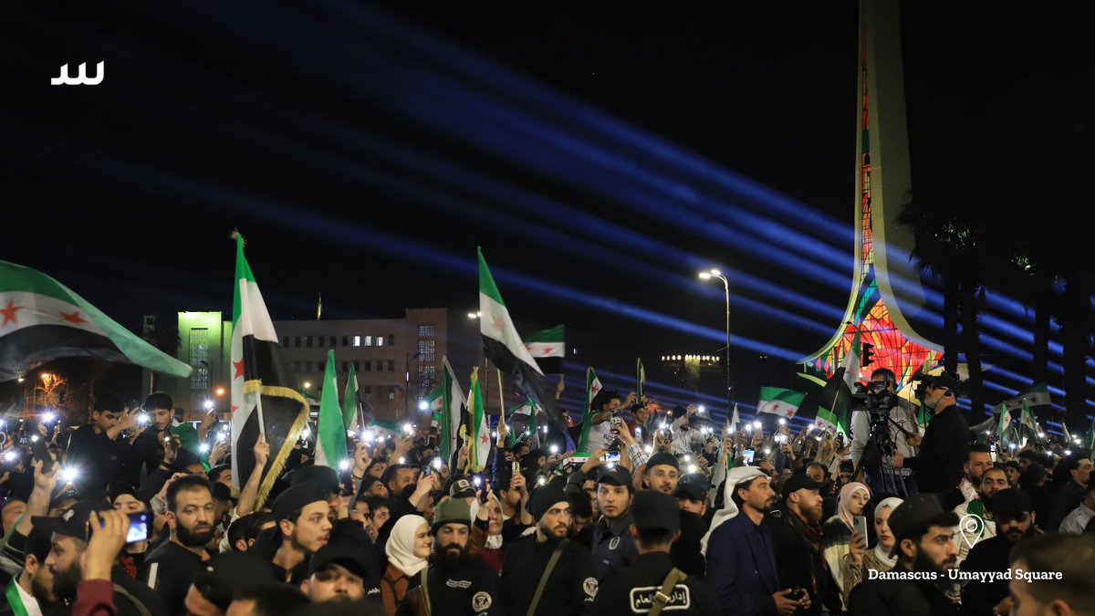 Nighttime celebrations mark the 14th anniversary of the Syrian revolution at Umayyad Square in Damascus. Governor of Damascus Maher Marwan, defected officer Maher al-Naimi and other figures attended the event.

📷<a href="/AlkarhAbd/">abd Almajed Alkarh</a> for <a href="/SyriaDirect/">Syria Direct</a>