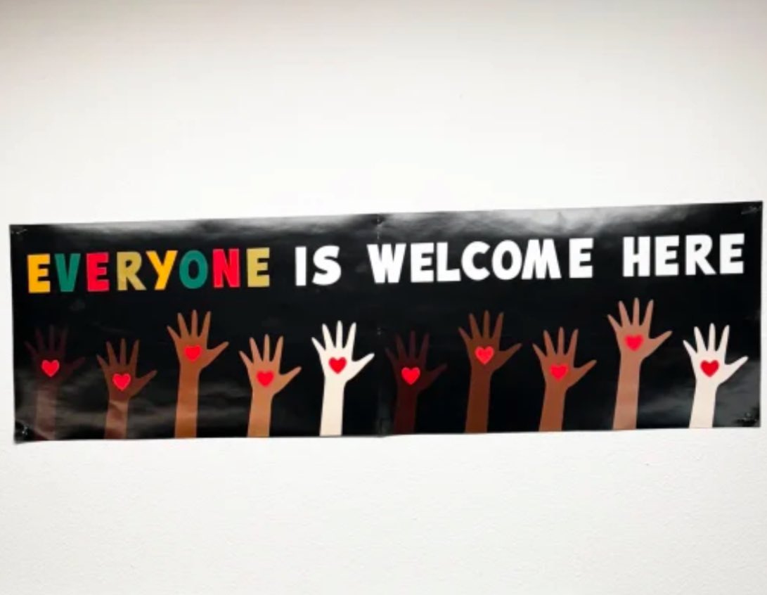 krassenstein's tweet image. BREAKING: An Idaho teacher is in a standoff with her own school district after officials ordered her to remove this classroom sign that reads, “Everyone is welcome here.” 

What the F—k is wrong with these people?  The opposite of this is literally “Everyone is NOT welcome here,”…