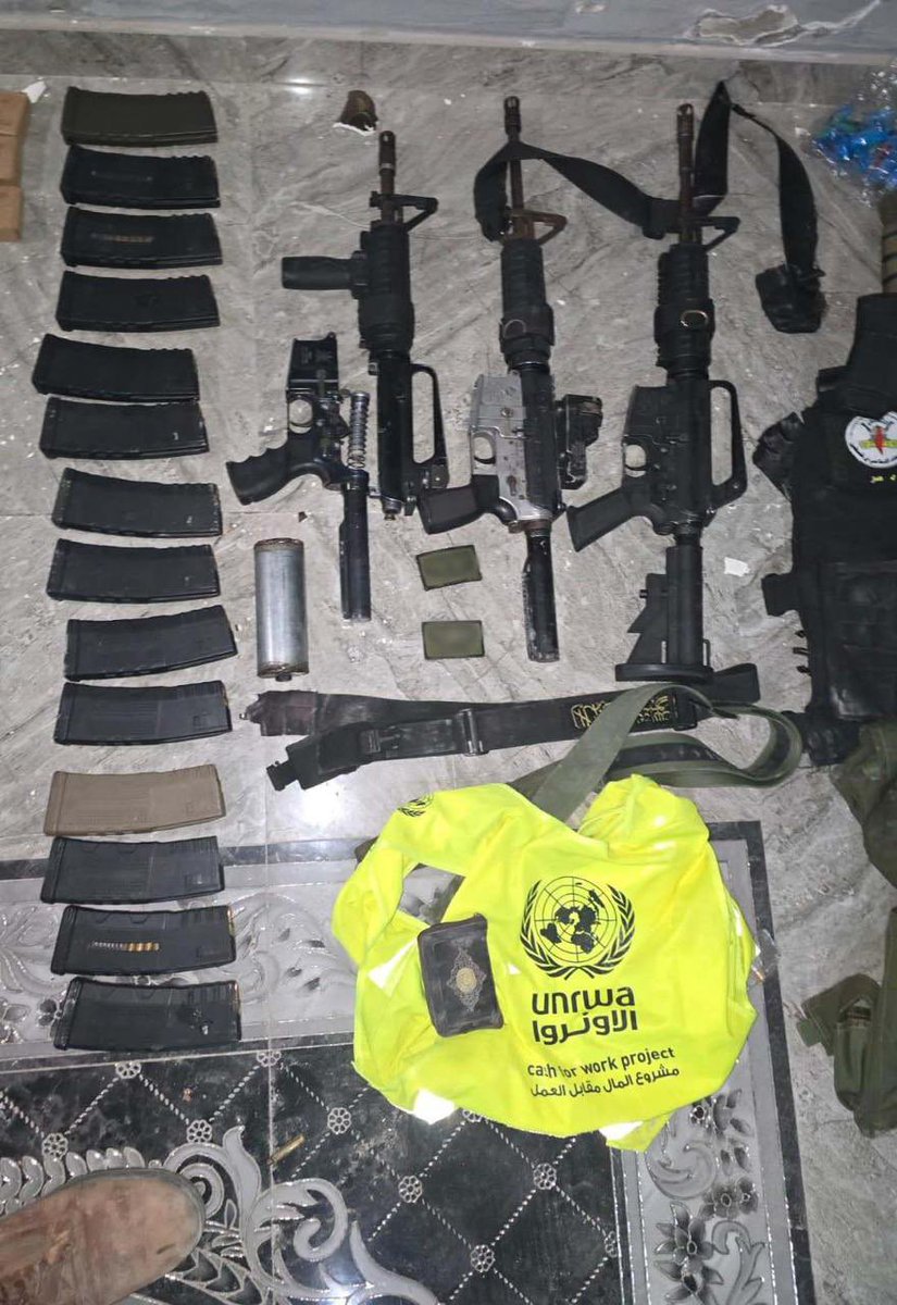 IDF's tweet image. Why is an @UNRWA bag in the same facility as automatic rifles?

During a counterterrorism operation in northern Samaria, IDF soldiers located a weapons storage facility in Nur Shams containing several weapons, a significant amount of ammunition, and bags filled with weapons.…