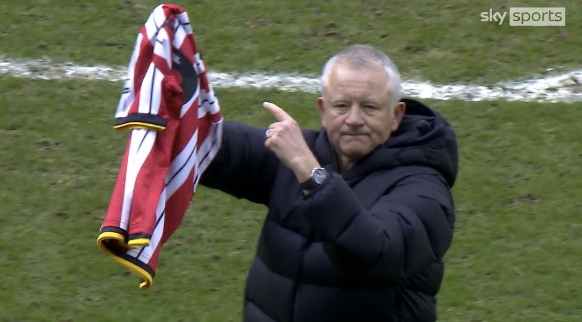 Chris Wilder holding up a George Baldock shirt in front of the Sheffield United fans after their derby day win 🔴⚪️