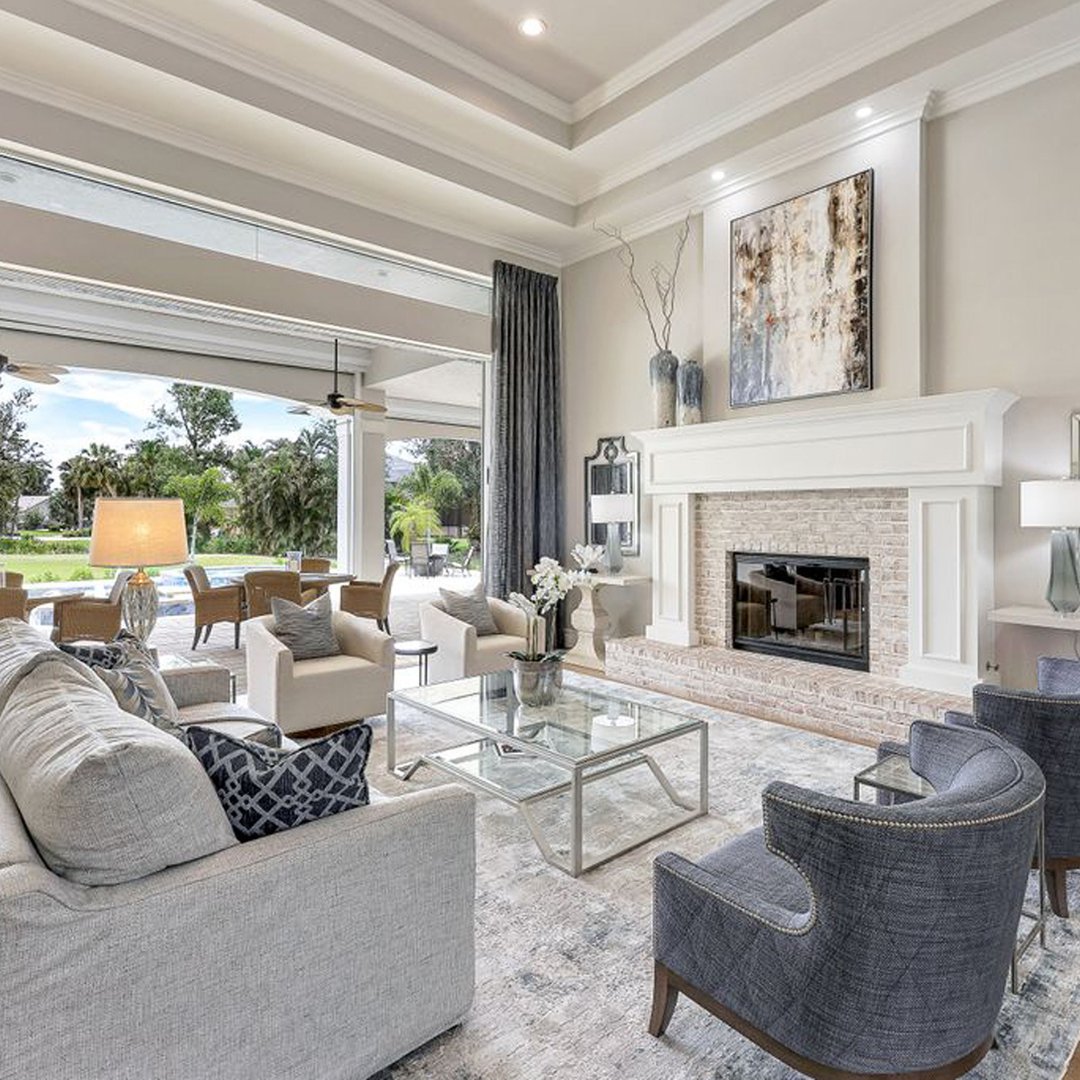 From soaring coffered ceilings to plush seating, this bright and airy space is made for both relaxing and entertaining. Neutral tones and metallic accents bring effortless sophistication. #GreatFallsVAInteriorDesigner #RestonInteriorDesigner #McLeanInteriorDesigner...