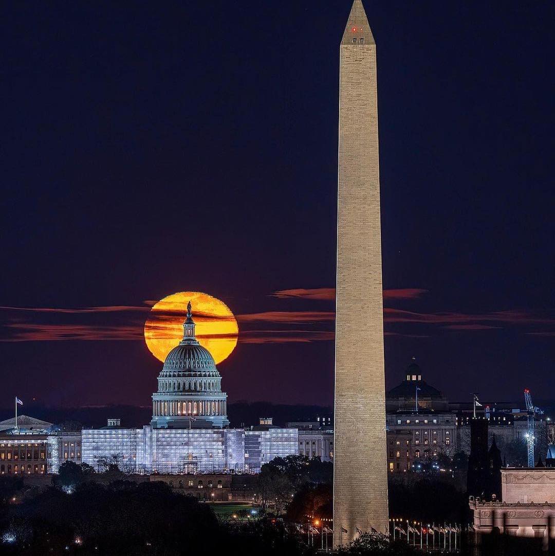 The U.S. Capitol between the Moon and the Washington Monument. March, 2023. Anonymous photographer.
