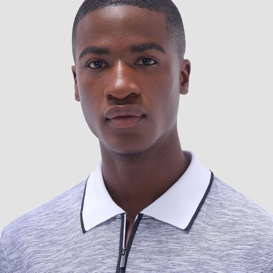 Lightweight, breathable, and undeniably stylish. Bugatchi’s latest polo features a textured knit with a subtle heathered pattern, blending casual comfort with refined sophistication.  Available now in-store and online at davidewhite.com