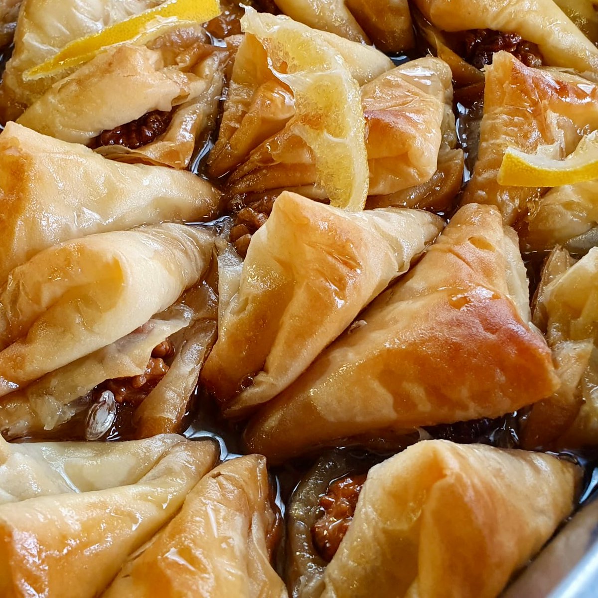 Baclava de Tulcea comes from the Turkish and Tatar communities in Tulcea, a city on the Danube in eastern Romania. The filo triangles are shaped individually, filled with chopped walnuts, then soaked in lemon-flavoured syrup after baking. Its story and recipe in my book, Danube.