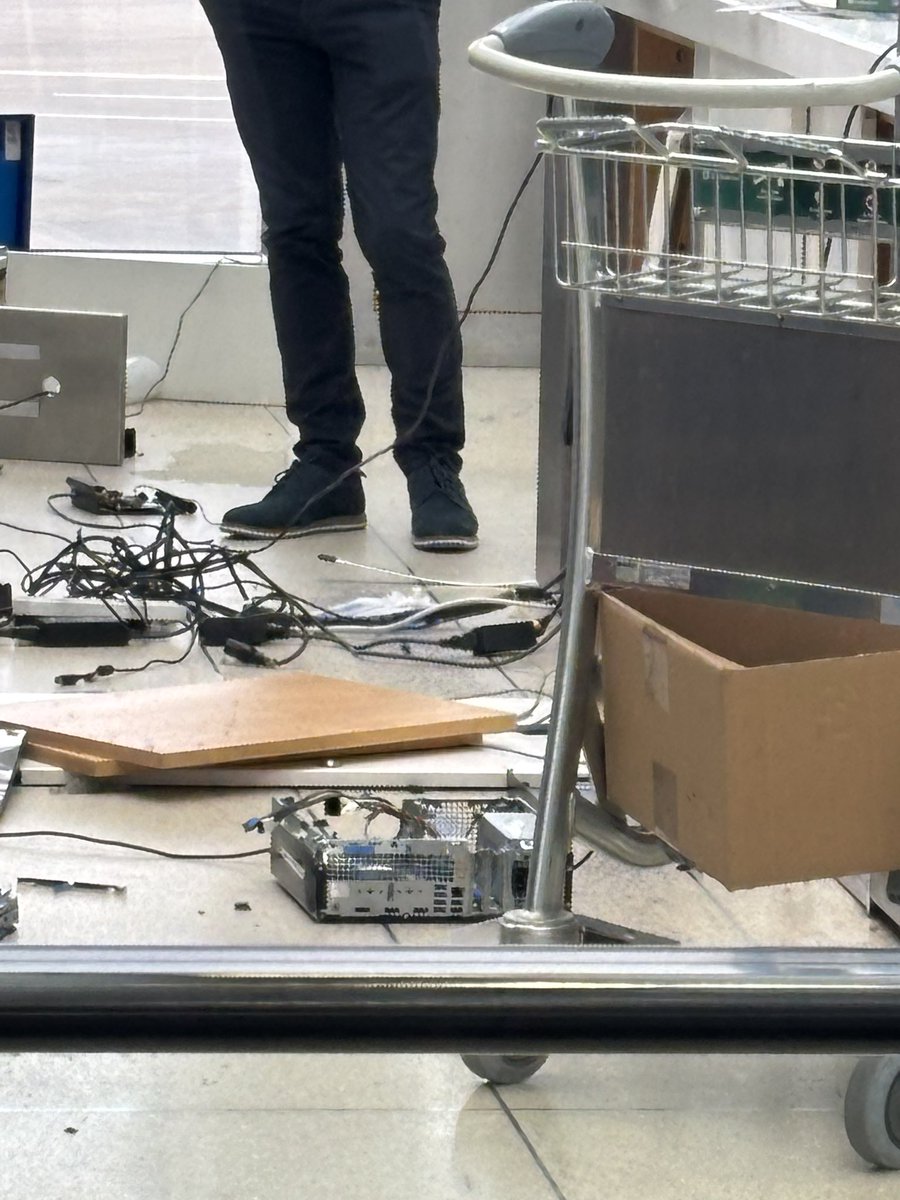 Irritated Ryanair passenger wreck the boarding gate electronics when asked to pay extra for his overweight suitcase.