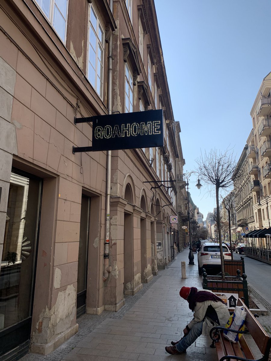 giancapodanno's tweet photo. 03/25 

This photo taken in Budapest shows a homeless man in front of a store selling artwork called GOAHOME. Could it look like a request from the person, or an invitation addressed to him by someone?In my opinion, the word HOME makes him feel less alone.. https://t.co/6NLLlf5cCo