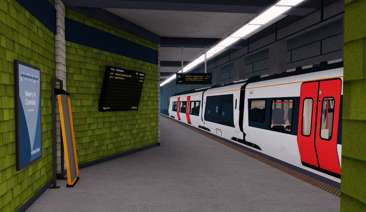 A rather red train at a rather green station! 🔴🟢