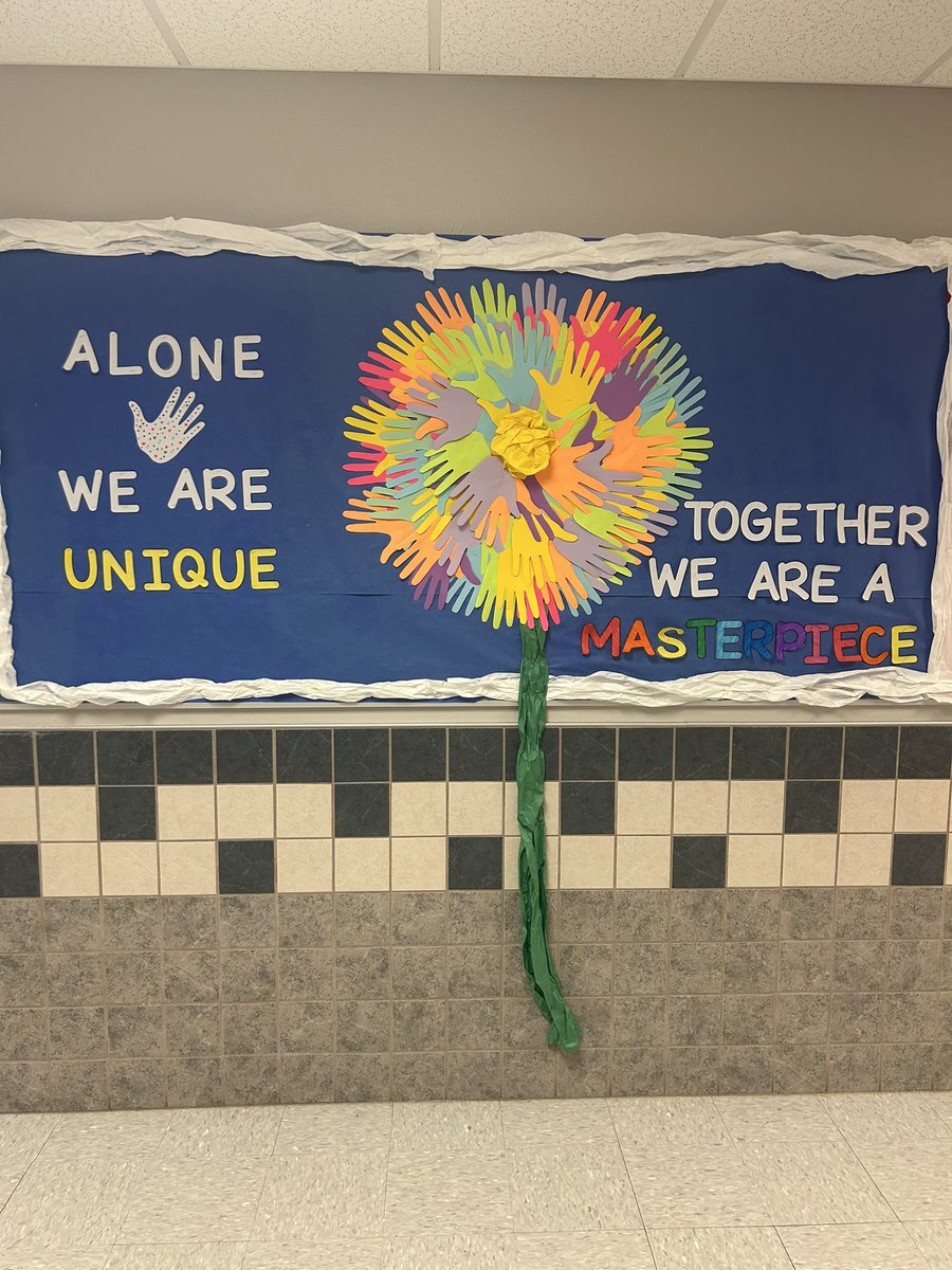 Student groups updating spring themed bulletin boards. This is Hope Squads: