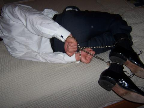 DanWales7's tweet photo. #Hogtying a #shirtandtie guy with #handcuffs & #legirons is good in 2 ways: 1. Taunt him by pretending he's wearing jewellery. 2. Hitch him up in just seconds & leave him, knowing that even if someone turns up willing to free him they can't unless they have key, lockpick or tools