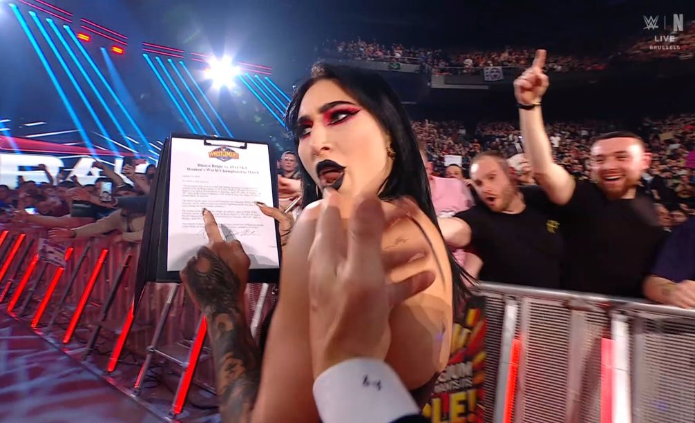 WrestleOps's tweet photo. Rhea Ripley has signed her name on the contract for the Women’s World Championship match at WrestleMania 41.

#WWERAW https://t.co/32uiogpVfW