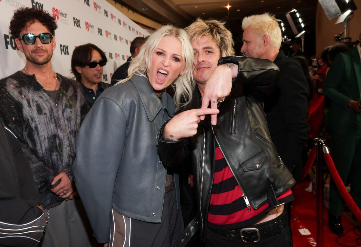 SOTSPodcast's tweet photo. Linkin Park and Green Day captured on the red carpet together during the iHeartRadio Awards 2025. https://t.co/y7qzkcNGmk