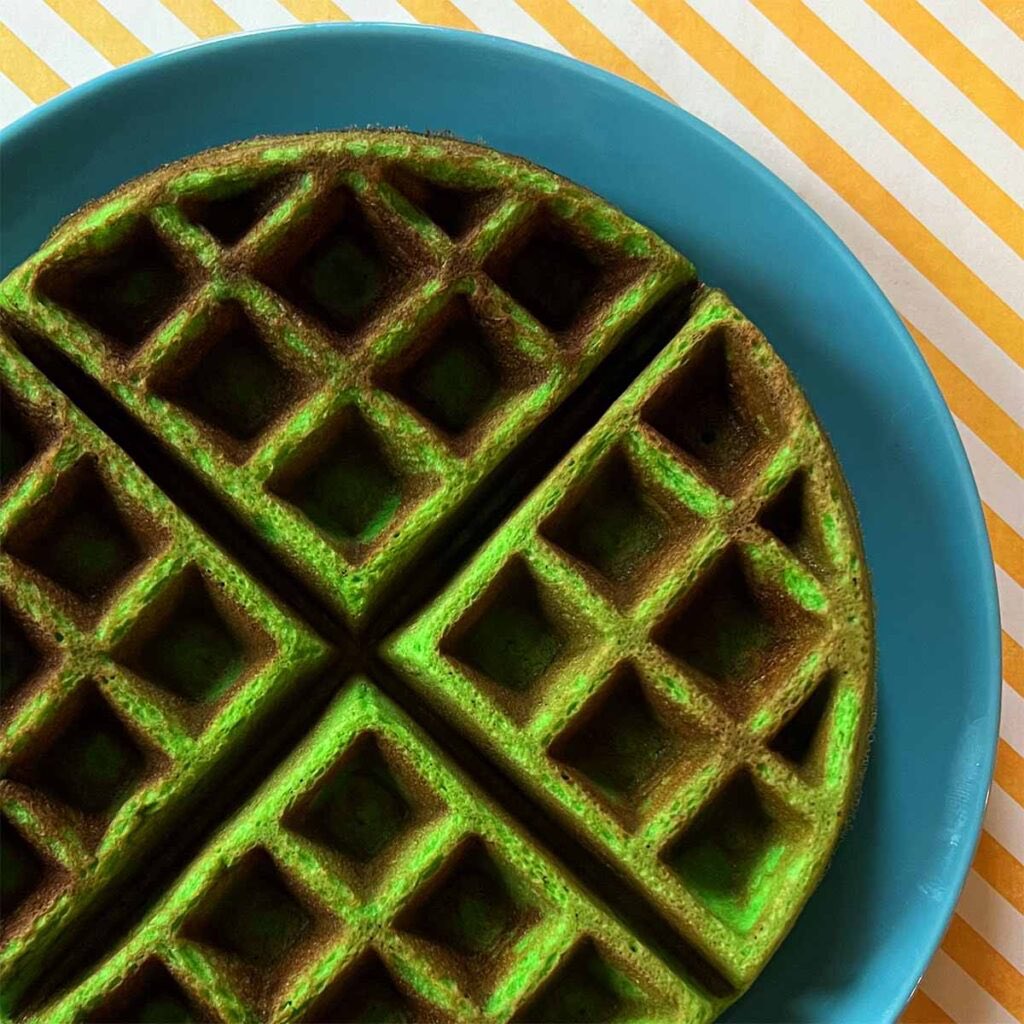 SabirahLohn's tweet photo. Every time I say, I’m going to be quiet about that annoying woman, she does something stupid.

She did not make that mess in that waffle maker. Anyone noticed something missing? 

The waffle maker has four sections. None of that slop she made has any sections. 

Come on people. At least call her lies out instead of just posting about her. This is what a four section waffle would looks like.