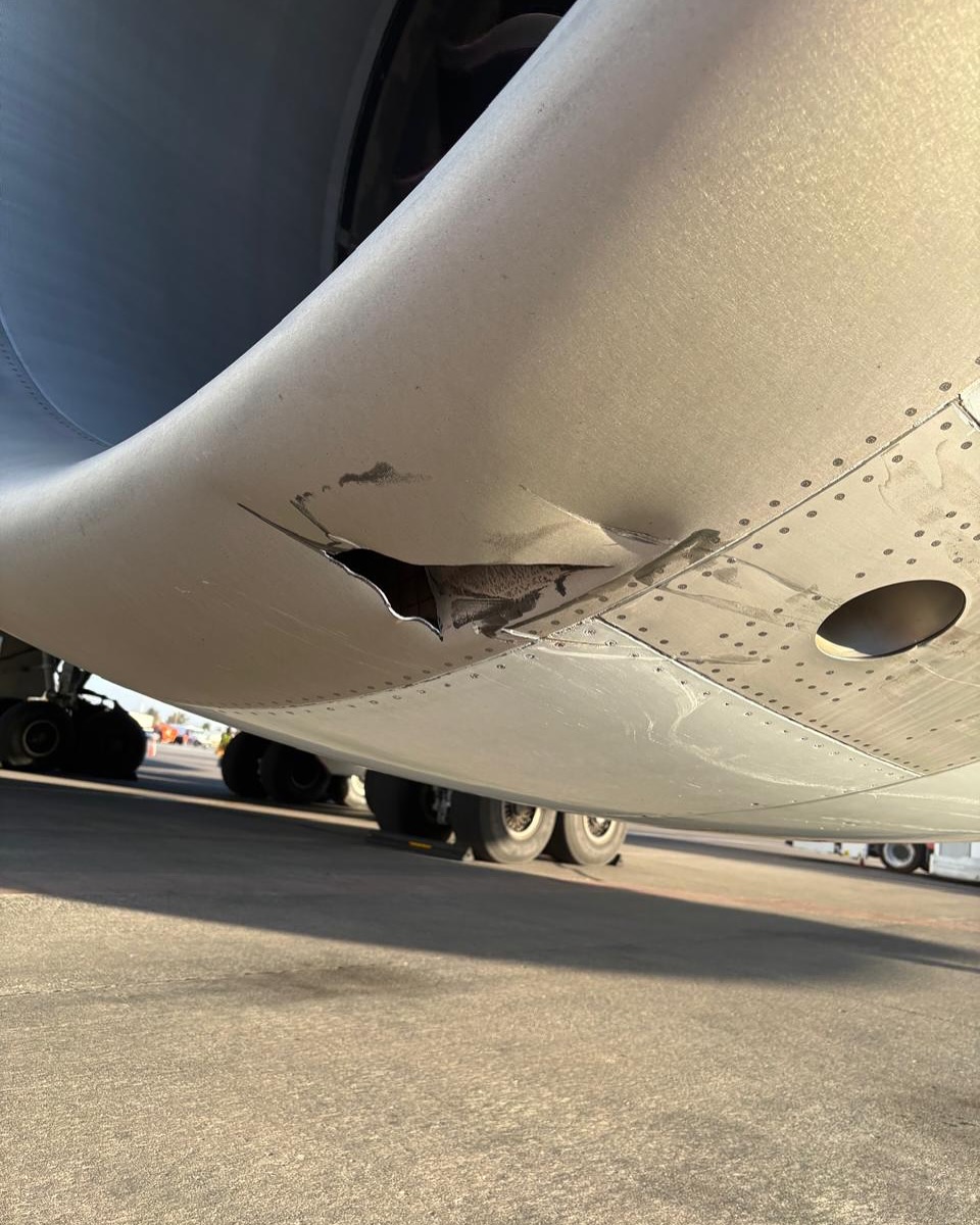 Cathay Pacific Cargo 747-867F strikes a runway sign while turning