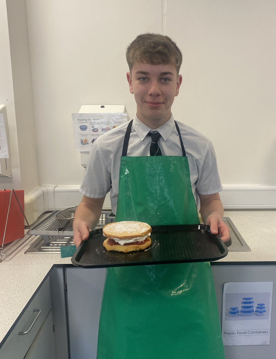 Logan S3, very pleased with himself for creating a tasty looking Victoria sponge cake. Folding, baking, whisking, eating!