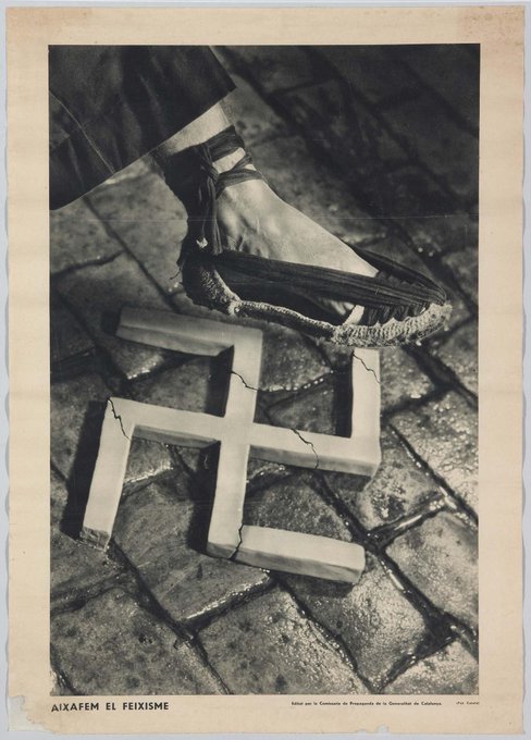 Another classic 1936 poster. "Aixafem el feixisme" (Let’s crush fascism) by Pere Català i Pic shows an espardenya (Cat) alpargata (Span), crushing a swastika on a wet, cobbled street of Barcelona, symbolising both fight by the working class against fascism and Catalan identity.