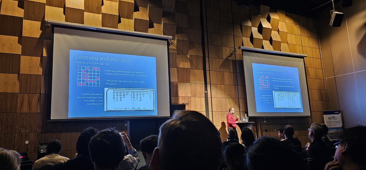 Luca Manzoni presenting work by Nils Aall Barricelli in the 1950s. Perhaps the first experiments with a coevolutionary algorithm.