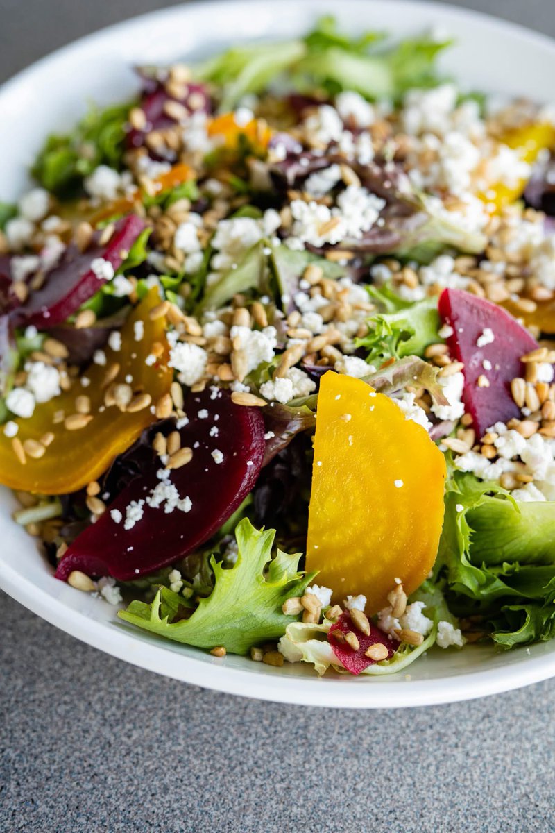 Citrus &amp; Beet is back! Field Greens topped with pickled red beets, roasted golden beets, goat cheese, roasted &amp; salted sunflower kernels, and a housemade orange zest vinaigrette. 🍊 Try it today at deweyspizza.com