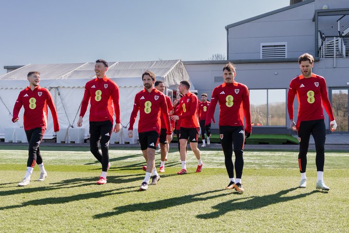 Cymru players walk out to training.