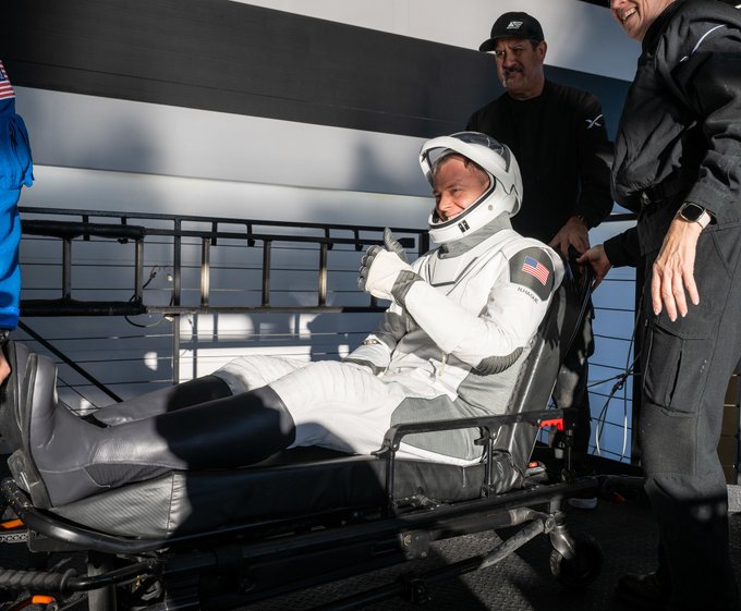 NASA astronaut Nick Hague is helped out of a SpaceX Dragon spacecraft onboard the SpaceX recovery ship Megan. Photo Credit: (NASA/Keegan Barber)