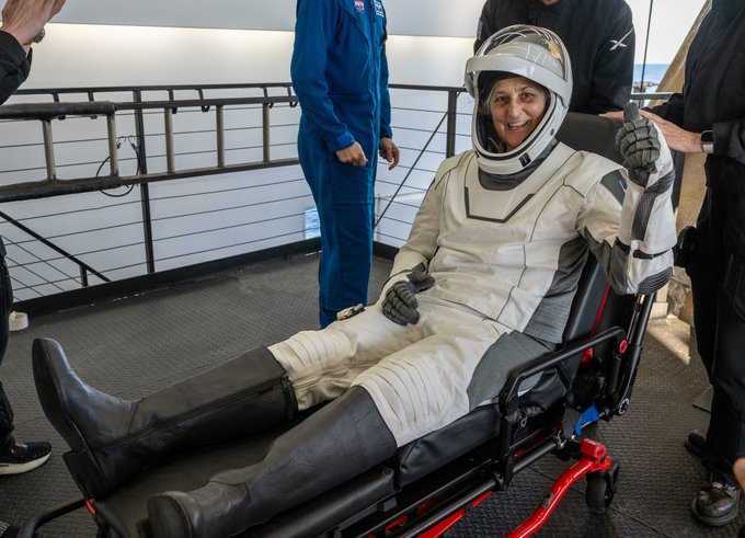NASA astronaut Suni Williams is helped out of a SpaceX Dragon spacecraft onboard the SpaceX recovery ship Megan. Photo Credit: (NASA/Keegan Barber)