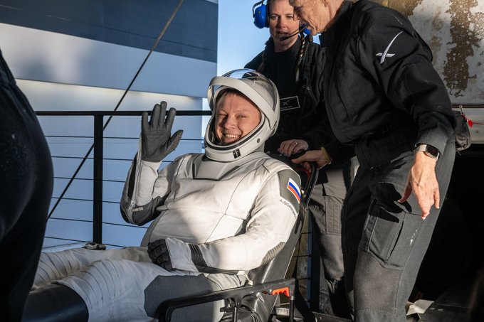 Roscosmos cosmonaut Aleksandr Gorbunov is helped out of a SpaceX Dragon spacecraft onboard the SpaceX recovery ship Megan. Photo Credit: (NASA/Keegan Barber)