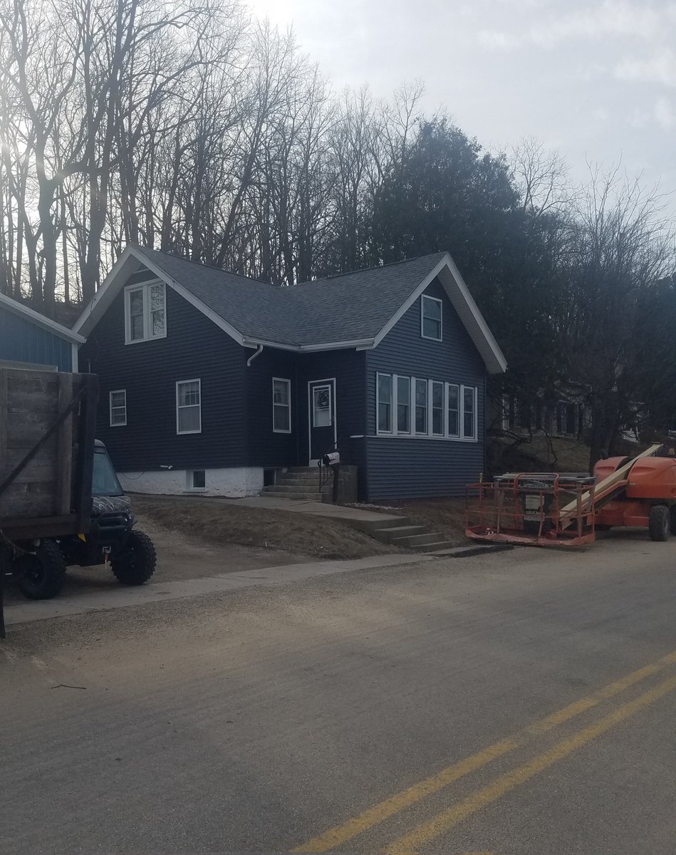 We have been working on this fixer upper for a few years now. Most of the inside is decent now. Last year, we did the roof and put up a garage. We have finally got around to replacing siding and some windows.