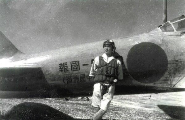 "Duty is heavier than a mountain; death is light as a feather"

A pilot smiles in front of a Mitsubishi Zero, used for Kamikaze missions