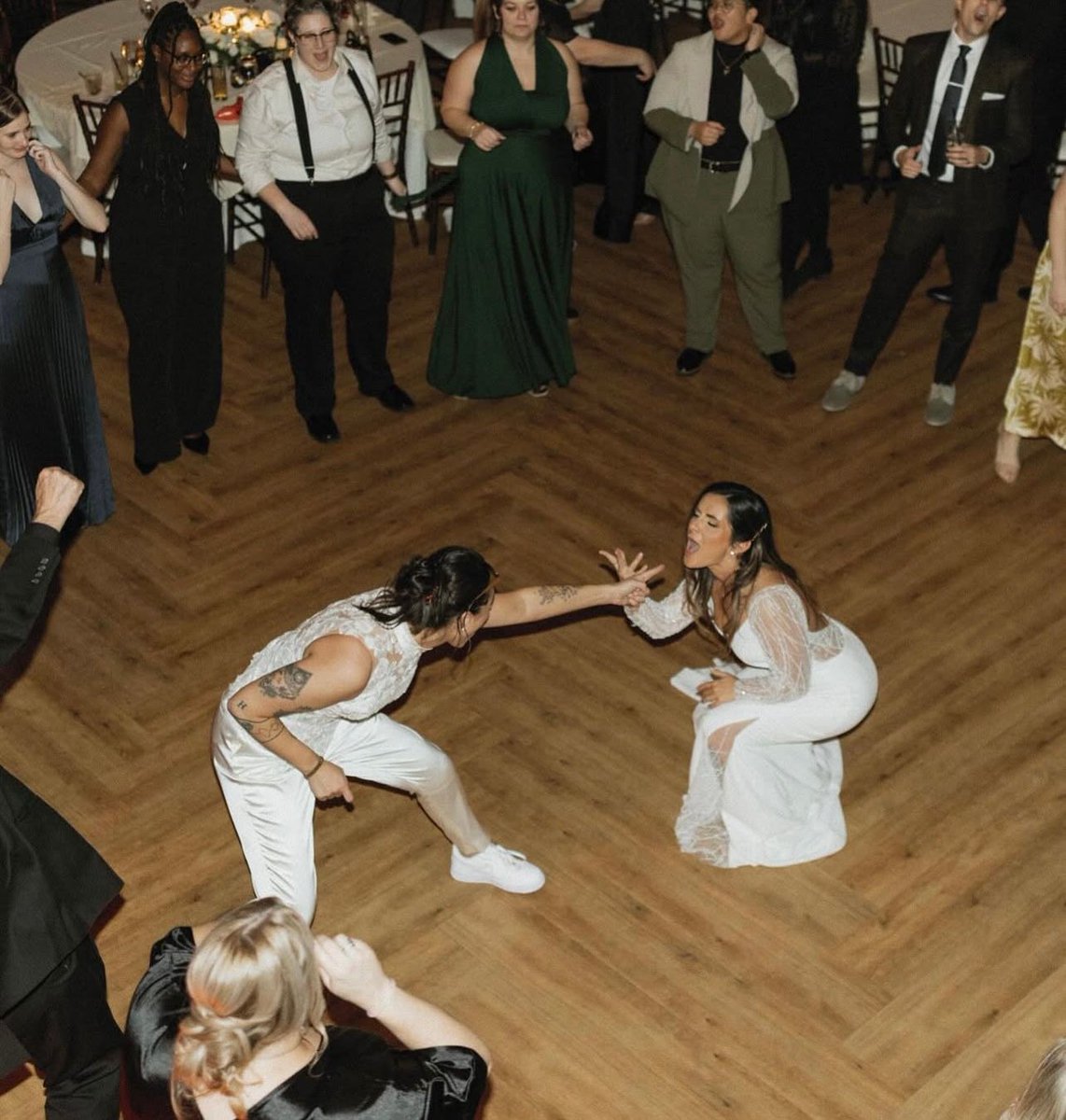 Now THAT is how you get married! We are still dreaming about Gina and Liz’s wedding back in December and just had to share it for you all to see!

Gina came in at a crossroads, not sure how to find the perfect wedding look that emulates a wedding garment without being too